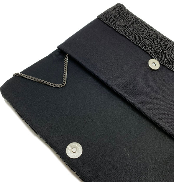 Purse interior with cloth lining and silver hardware