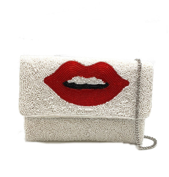 Rectangular beaded white purse with central red lips design and a silver chain to the right