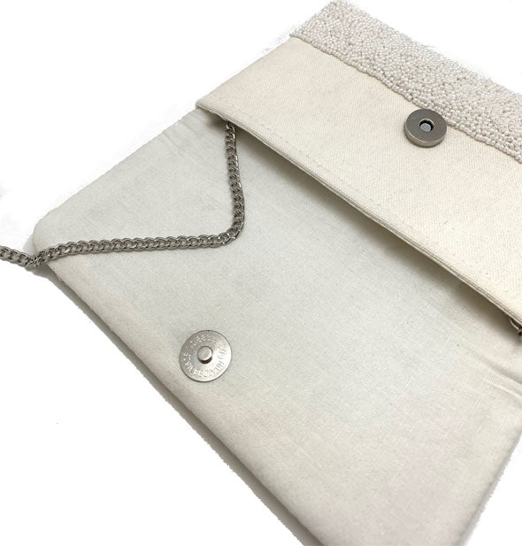 Purse interior with canvas lining and silver hardware