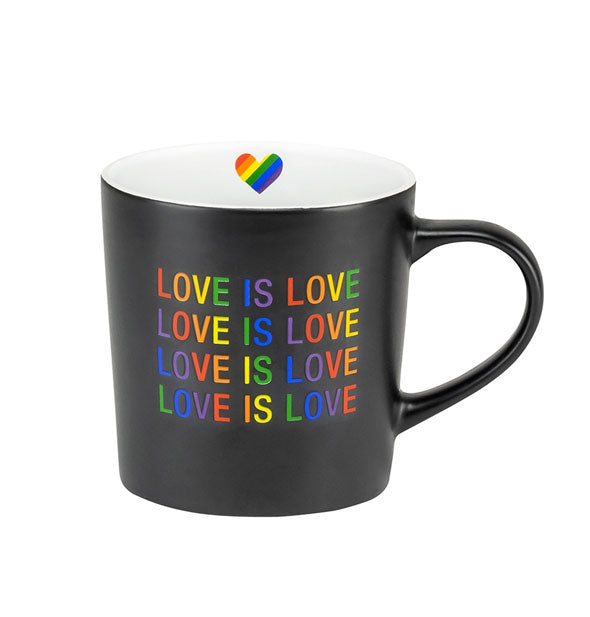 Black coffee mug with white interior features rainbow heart graphic and says, "Love Is Love" repeated four times in multicolor lettering