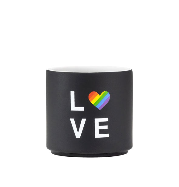 Black planter with matte finish and white interior says, "Love" in white lettering with a rainbow striped heart in place of the O