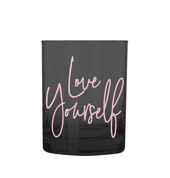 Black double old fashioned rocks glass with pink lettering that says, "Love Yourself"