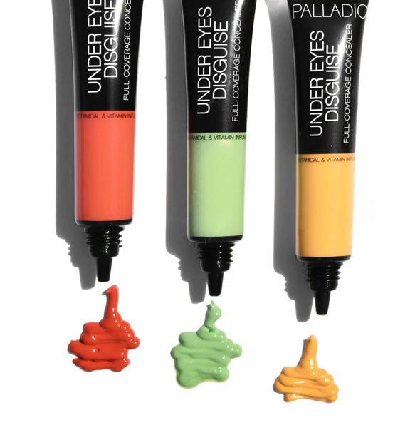 Three tubes of Palladio Under Eyes Disguise concealer in red, green, and yellow color correcting shades