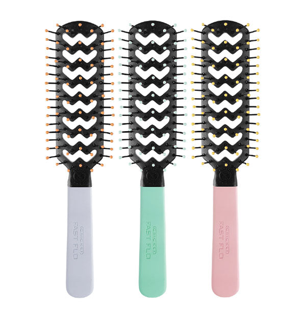 Three vented hairbrushes with purple, green, and pink handles