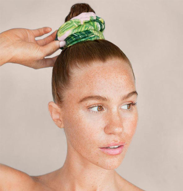 Model wears Palm Leaf print towel scrunchy in a topknot