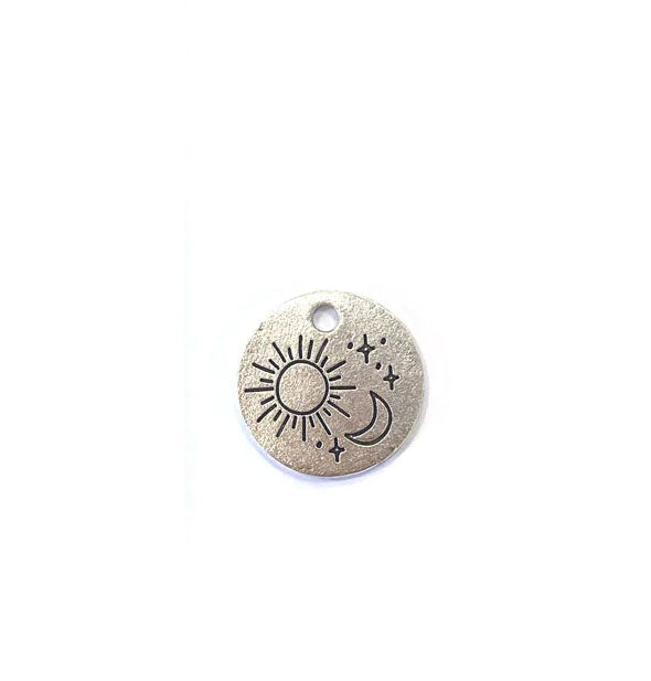 Round silver tab charm with engraved sun, moon, and stars symbols