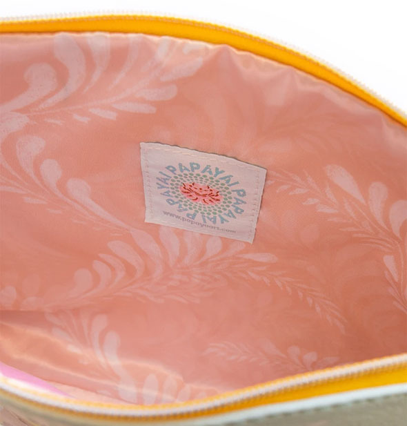 Pouch interior with pink patterned lining and Papaya label