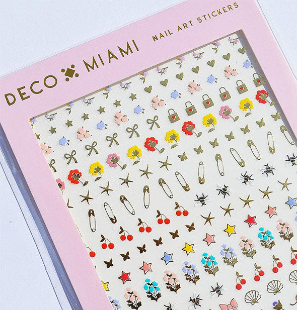 Pack of Deco Miami Nail Art Stickers with a variety of floral, star, seashell, and clothespin designs shown