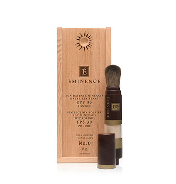 Eminence Sun Defense Minerals SPF powder with cap removed to show brush next to wood box packaging