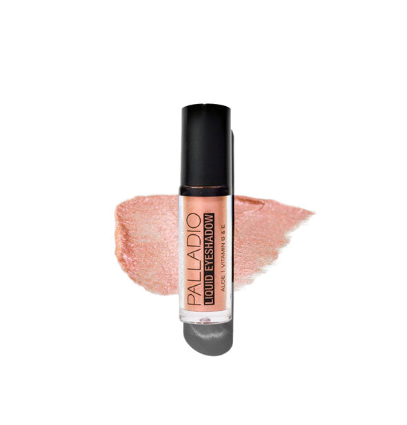 Tube of Palladio Liquid Eyeshadow in a metallic peach-pink shade with color swatch behind