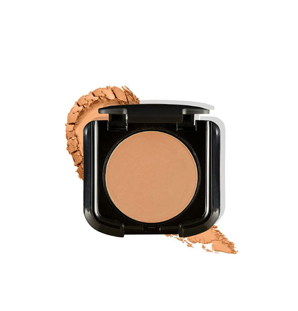 Makeup powder compact with crushed sample behind in a tan shade