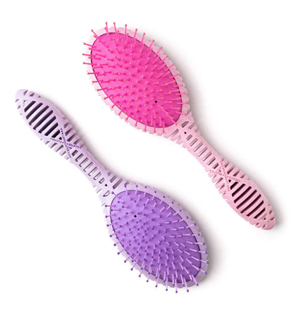 Two paddle hairbrushes, one pink and one purple, with slotted handle design