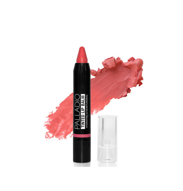 Black stick of Palladio Tinted Lip Balm with pointed tip and application behind in a pink shade