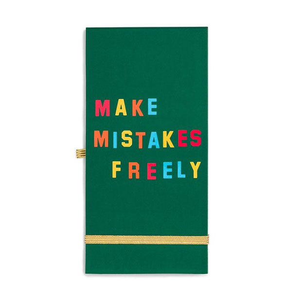 Green notebook cover with colorful lettering and gold elastic bands