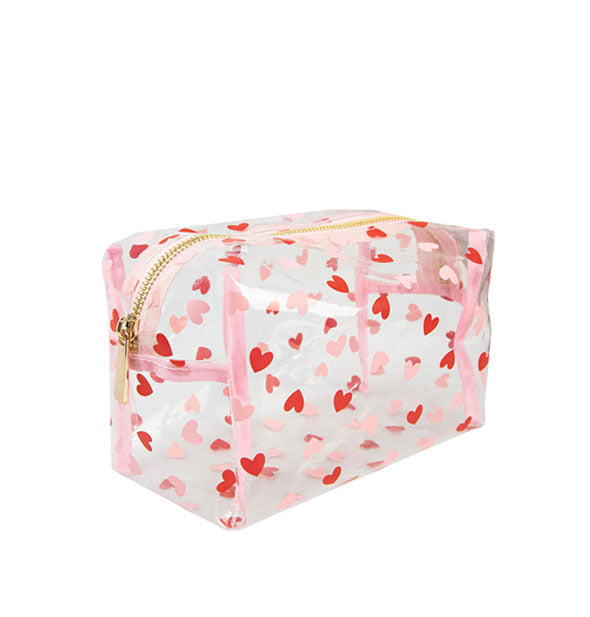 Clear rectangular pouch with top gold zipper and all-over pink and red hearts print
