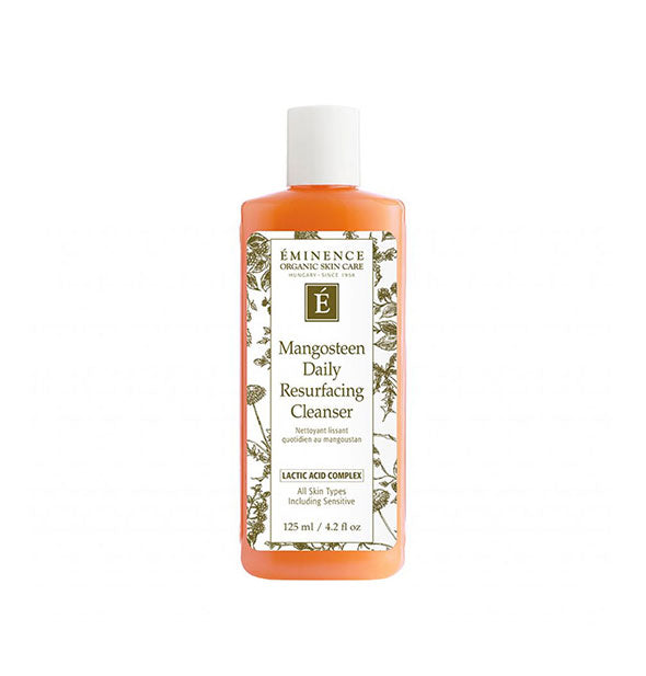 Orange 4.2 ounce bottle of Eminence Organic Skin Care Mangosteen Daily Resurfacing Cleanser with white and green floral patterned label