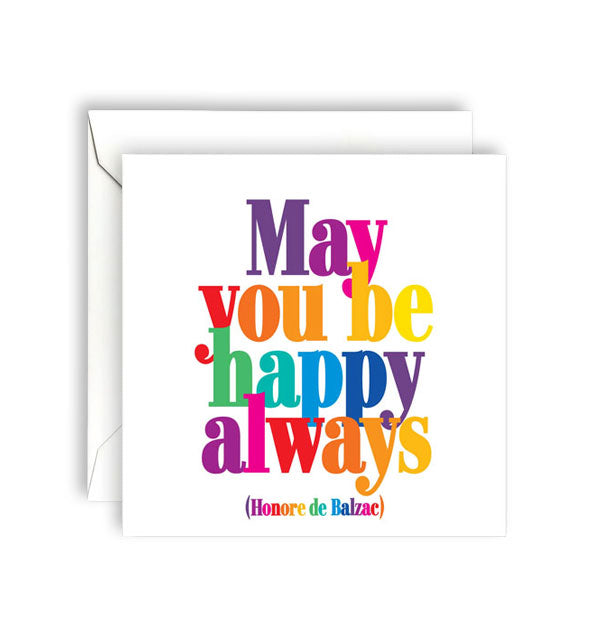Square white greeting card with envelope is printed in multicolored lettering with a quote by Honore de Balzac: "May you be happy always"