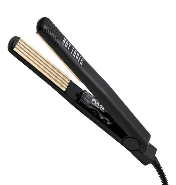 Open black Hot Tools hair crimper with gold plates and a Pulse Technology label on the inside of the hande