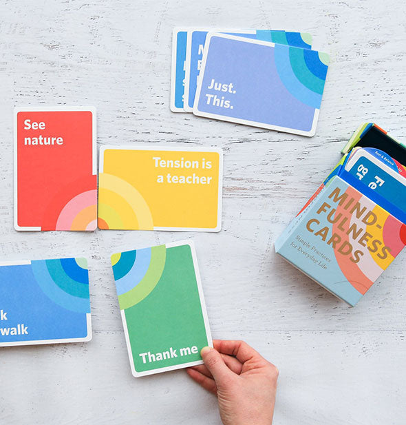 Spread of Mindfulness Cards on a painted wooden surface