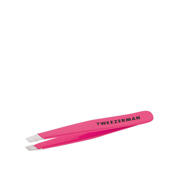 Pink tweezer with black Tweezerman logo on the handle has slanted stainless steel tips