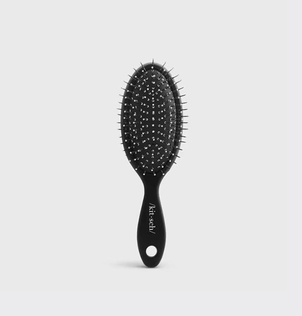 Mini black hairbrush by Kitsch