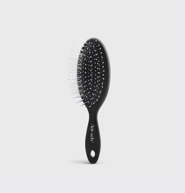 Mini black hairbrush by Kitsch