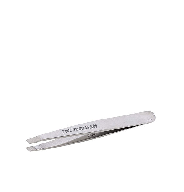 Mini silver tweezer with stamped Tweezerman logo has slanted tips