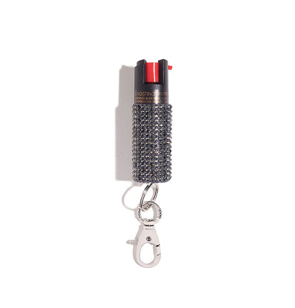 Dark gray rhinestone-encrusted pepper spray canister with rose gold lobster clasp attached
