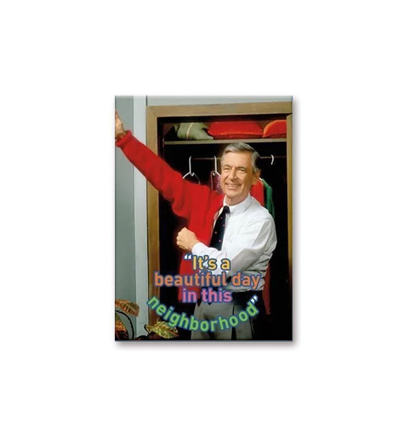 Rectangular magnet with image of a smiling Mister Rogers putting on a red cardigan says, "It's a beautiful day in this neighborhood"