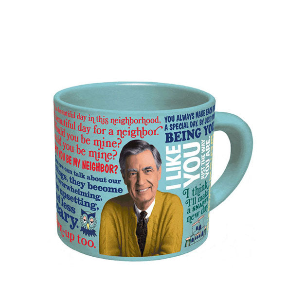 Light blue coffee mug with image of Mister Rogers wearing a yellow sweater and surrounded by quotes of his in different colors and typefaces