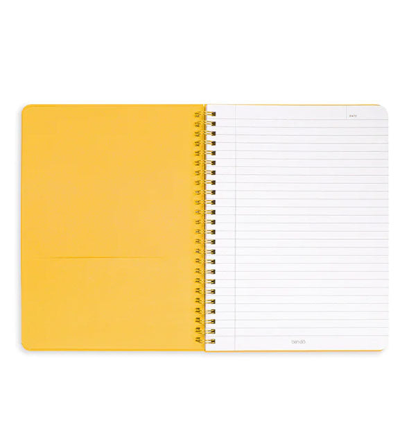 Journal interior features yellow pocket page at left and white lined page at right