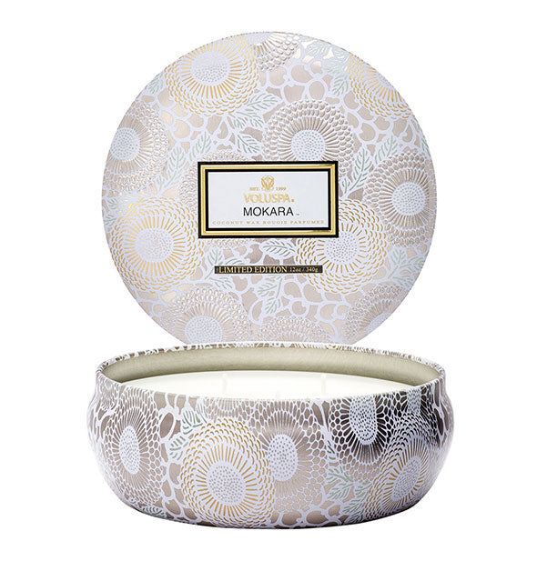 Round white floral Mokara Voluspa tin candle with lid removed