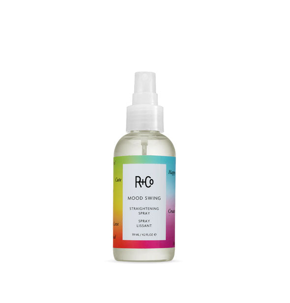 3 ounce bottle of R+Co Mood Swing Straightening Spray with rainbow-colored label