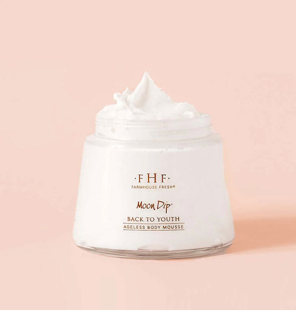 Jar of FarmHouse Fresh Moon Dip Back to Youth Ageless Body Mousse with product dolloped on top