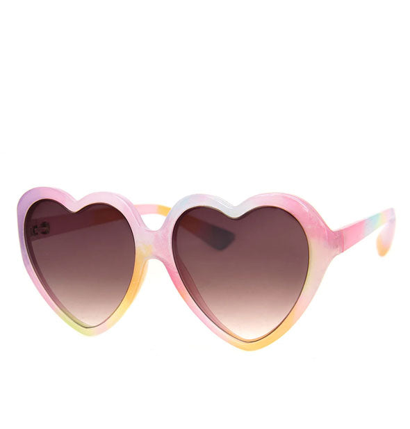 Heart-shaped sunglasses with tie dye effect pastel pink, yellow, and blue frame