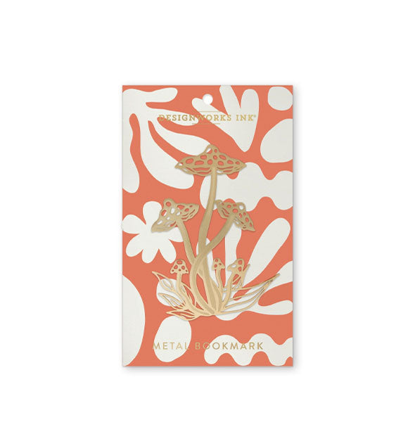 Metallic gold mushrooms bookmark on a DesignWorks Ink product card printed with orange and white abstract shapes pattern