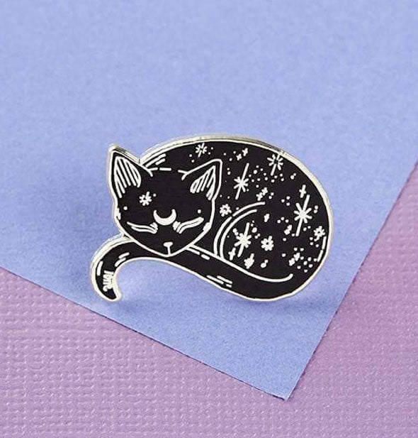 Black celestial cat pin on purple background