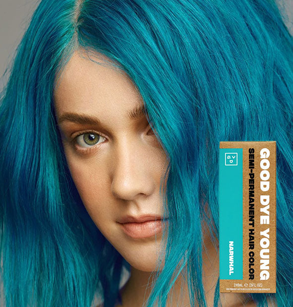 Model with bright blue-green hair color by Good Dye Young in the shade Narwhal