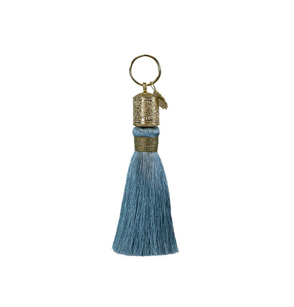 Gray-blue tassel keychain with decorative gold hardware