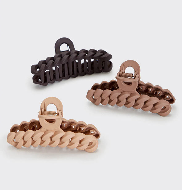 Pack of three hair clips featuring a braided/chain design in warm, neutral shades with a matte finish