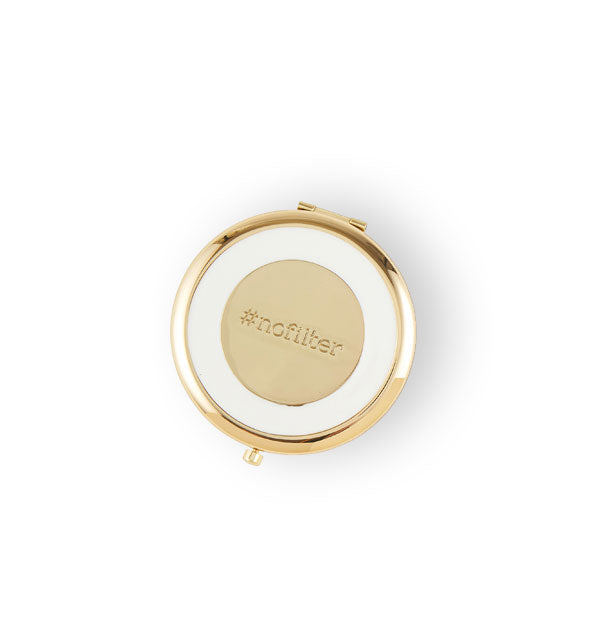 White and gold compact mirror is engraved with, "#nofilter" in the center
