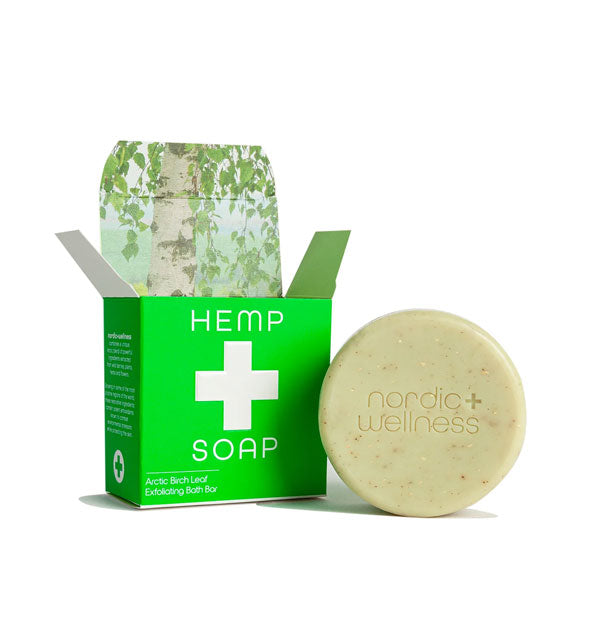 Round Nordic+Wellness Hemp Soap bar with green and white box featuring a leafy printed interior