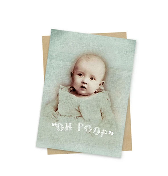 Muted green greeting card with portrait of a baby says, "Oh poop" in white lettering near the bottom