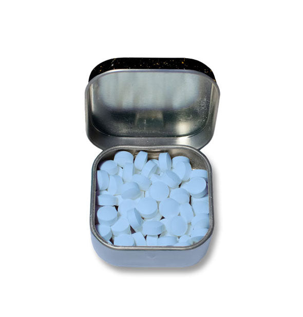 Open tin with pieces of blue candy inside