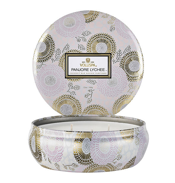 Round white and gold Panjore Lychee Voluspa candle tin with lid removed