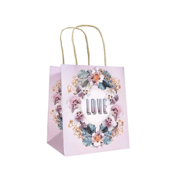 Blush pink-purple gift bag with a wreath of pansies says, "Love" in the middle