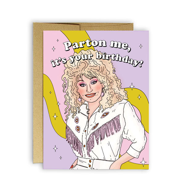 Greeting card with kraft envelope behind features illustration of Dolly Parton wearing a white jacket with pink fringe under the words, "Parton me, it's your birthday!" in white lettering