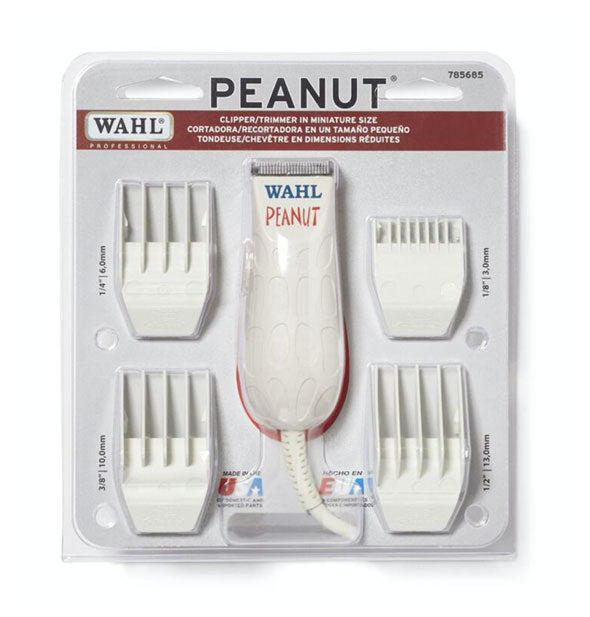 White Wahl Peanut clipper with four attachments in clear packaging on backer card