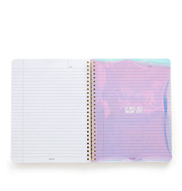 Open notebook with spiral-bound lined purple and white pages, one of which says, "It will all work out" in the middle