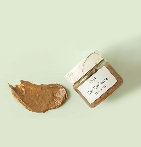 Pot of Peat Perfection mask with product sample alongside it